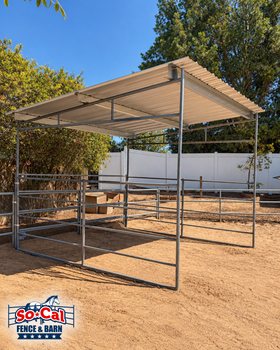 A freestanding horse shelter with a metal roof